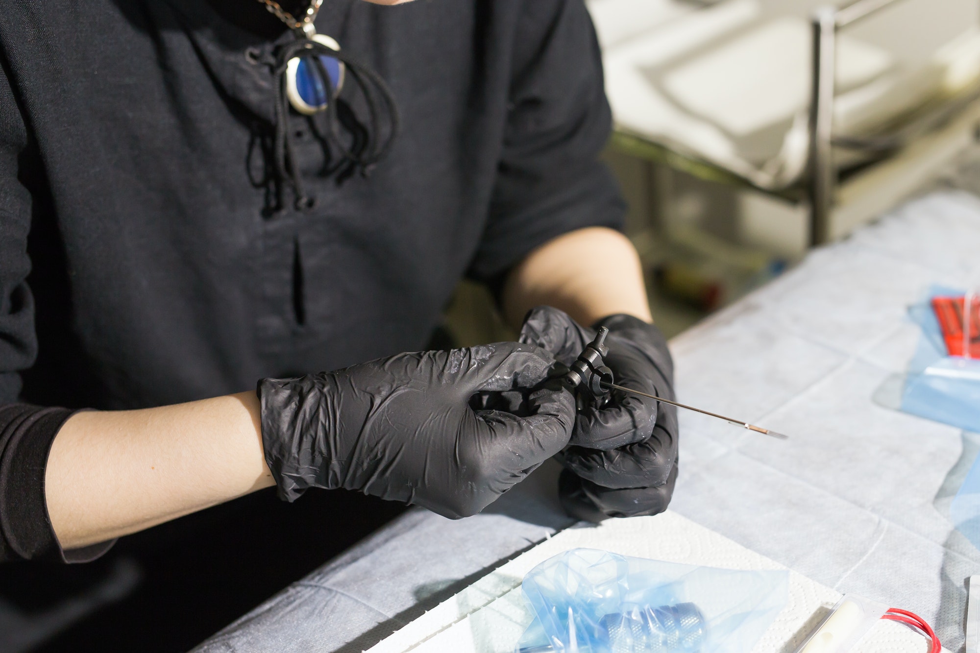 master tattoo artist prepares tools for tattooing